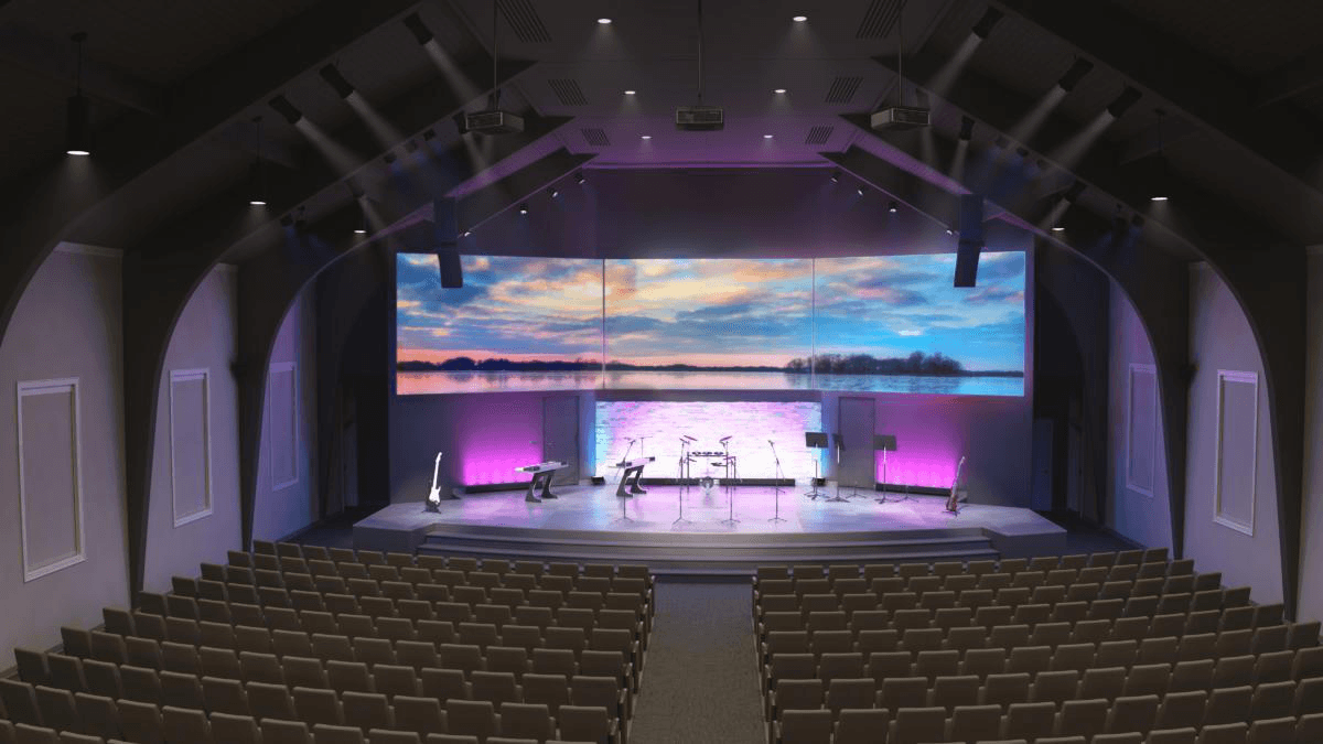 Church auditorium with stage lighting and large display